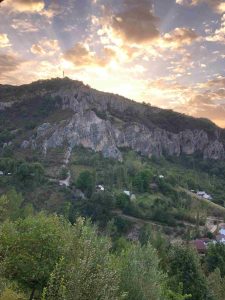 Expert local guide leading a small private trekking group through a pristine Kyrgyz valley