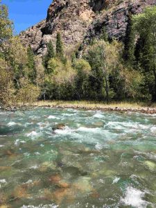 A private tent setup in a remote alpine meadow during a Kyrgyzstan trekking tour