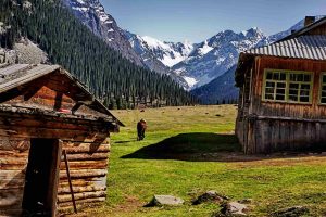 Nomads with an eagle against a mountain backdrop in Kyrgyzstan